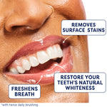 A smile with white teeth showing. In text: Removes surface stains. Restore your teeth's natural whiteness. Freshens breath. *With twice daily brushing.