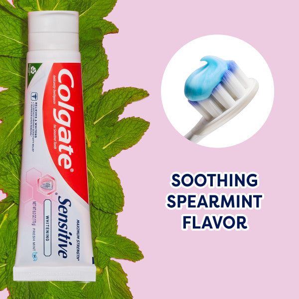 A tube of Colgate Sensitive Maximum Strength Whitening Toothpaste on mint leaves. In text: Soothing spearmint flavor.