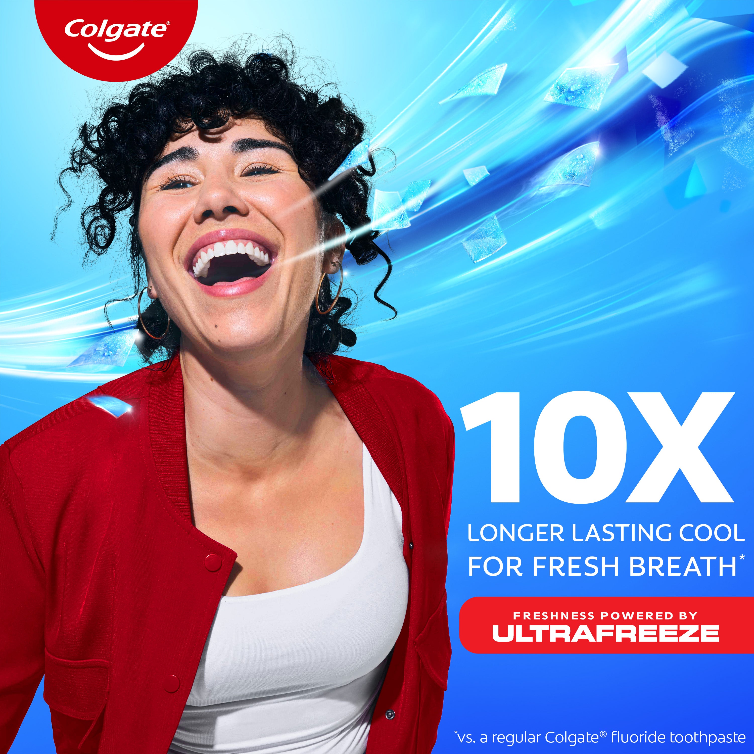 A woman with white teeth smiling. In text: 10x longer lasting cool for fresh breath*. Freshness powered by ultrafreeze. *vs. a regular Colgate fluoride toothpaste.