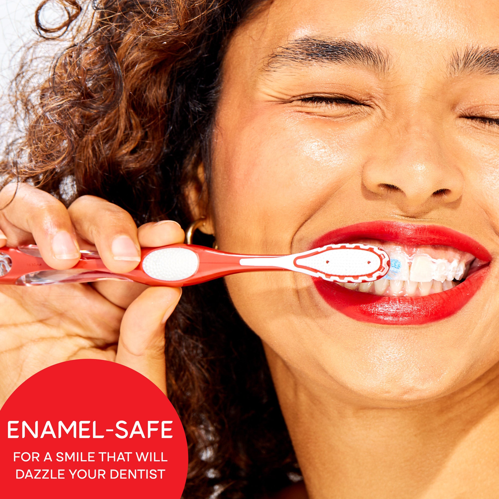 A woman smiling and brushing her teeth. In text: Enamel-safe for a smile that will dazzle your dentist.