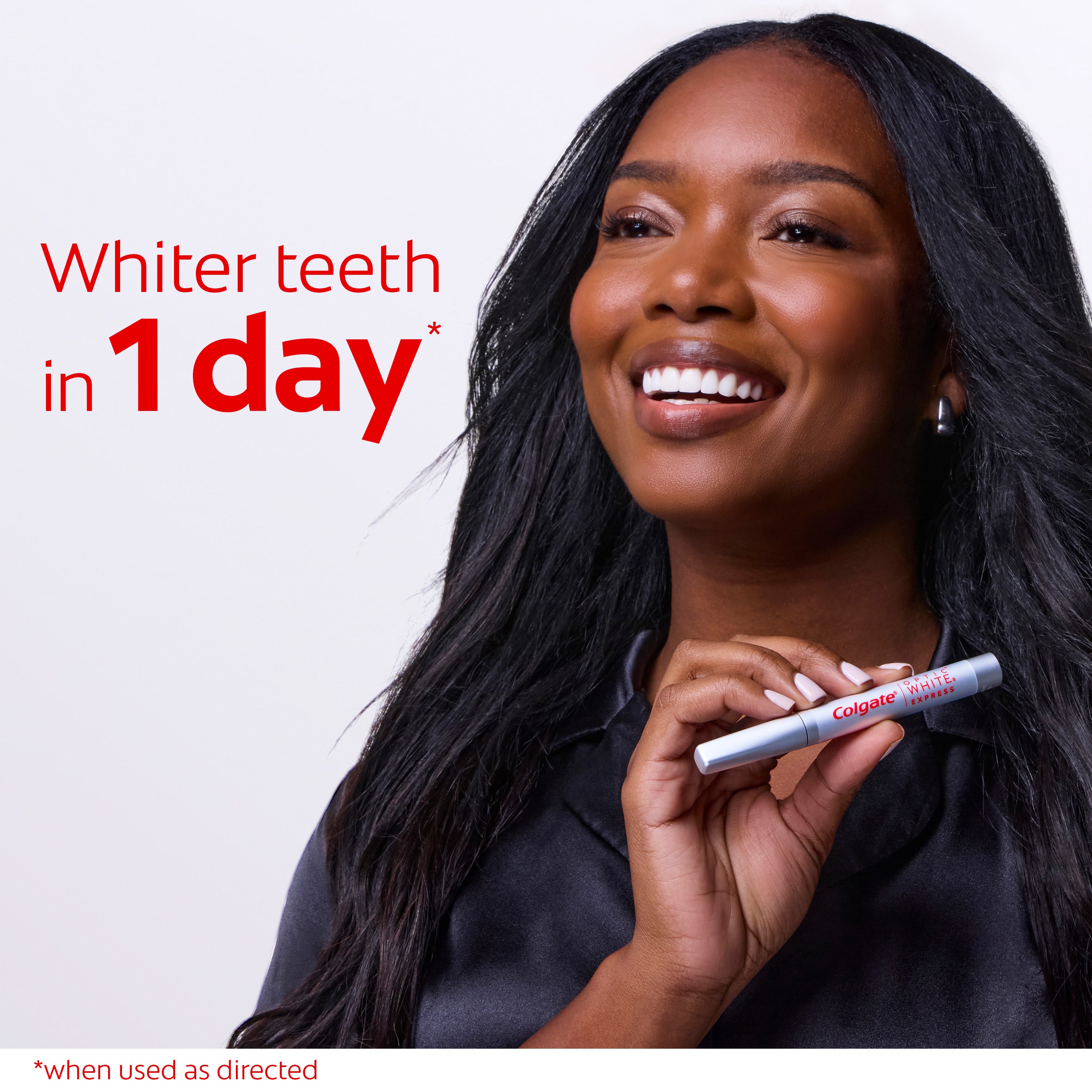 Woman holding a Colgate Optic White Express Teeth Whitening Pen. In text: Whiter teeth in 1 day* *when used as directed.