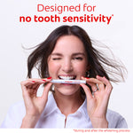 Woman holding a Colgate Optic White Express Teeth Whitening Pen. In text: Designed for no tooth sensitivity* *during and after the whitening process